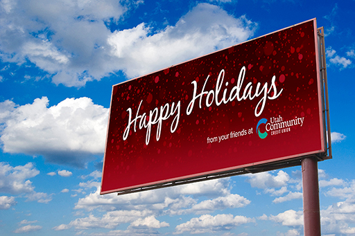 red snowy billboard reading Happy Holidays from your friends at UCCU